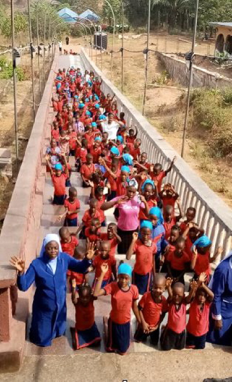Pupils from the Primary School of the Two Hearts of Love, Orlu are climbing Holy Steps